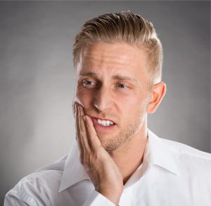 Man with jaw pain who received TMD treatment from a TMJ specialist in Murfreesboro.