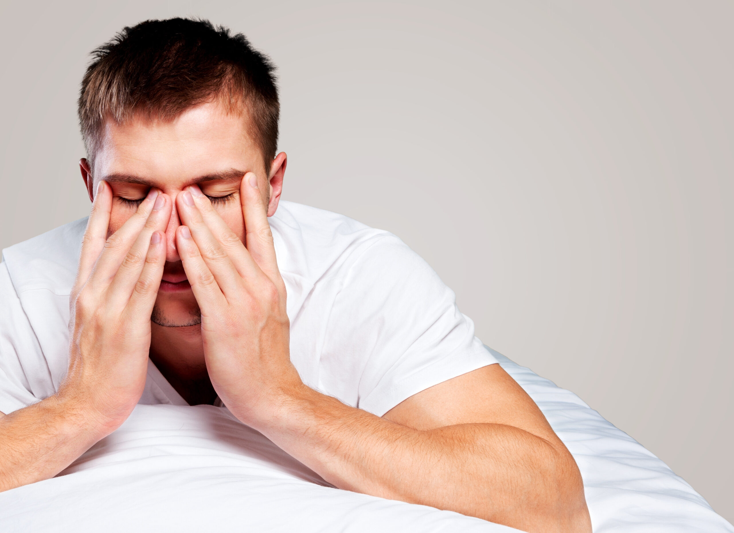 man suffering from lack of sleep, possible sleep apnea