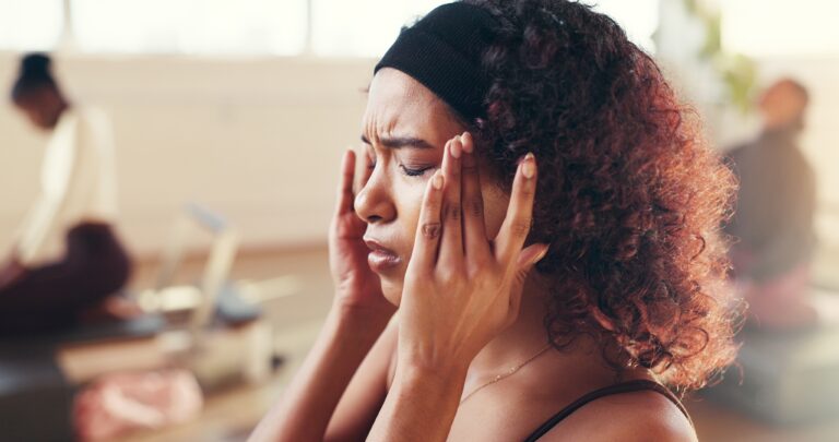Woman, headache and stress with pain from TMJ related tension